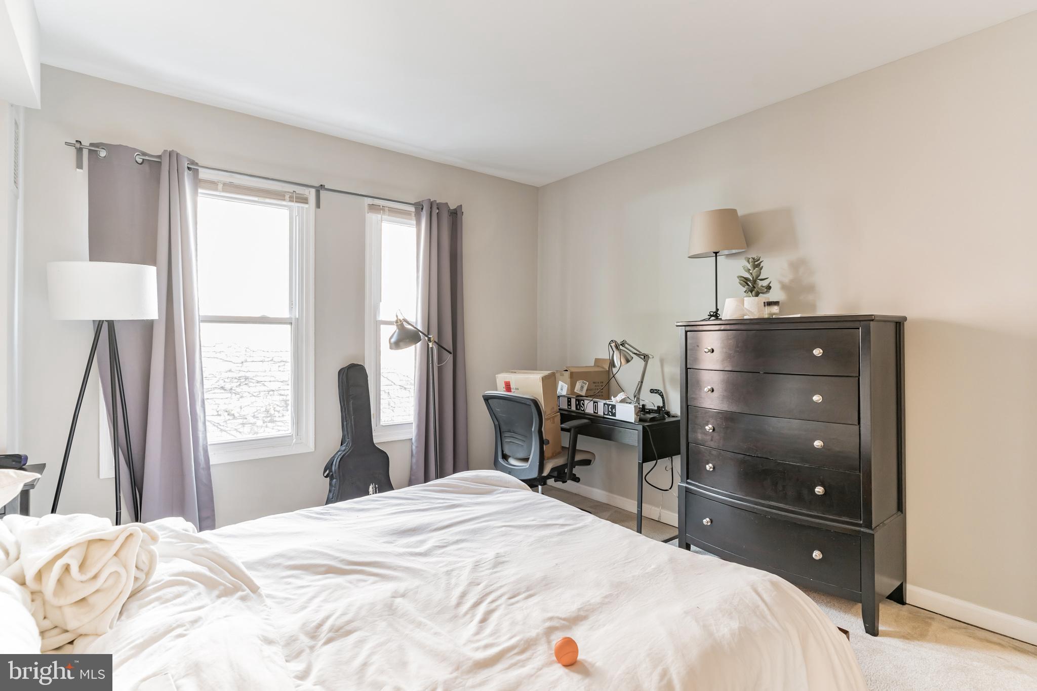 1208 1/2 33rd Street Northwest Washington, DC 20007 - Photo 26 of 30 a bedroom with a bed and a dresser