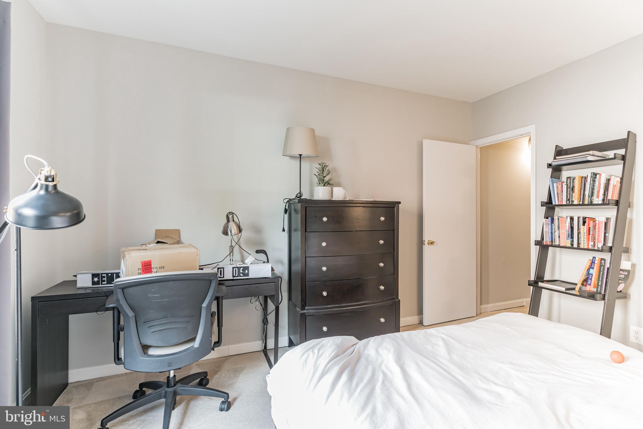 1208 1/2 33rd Street Northwest Washington, DC 20007 - Photo 27 of 30 a bedroom with a bed and cabinets