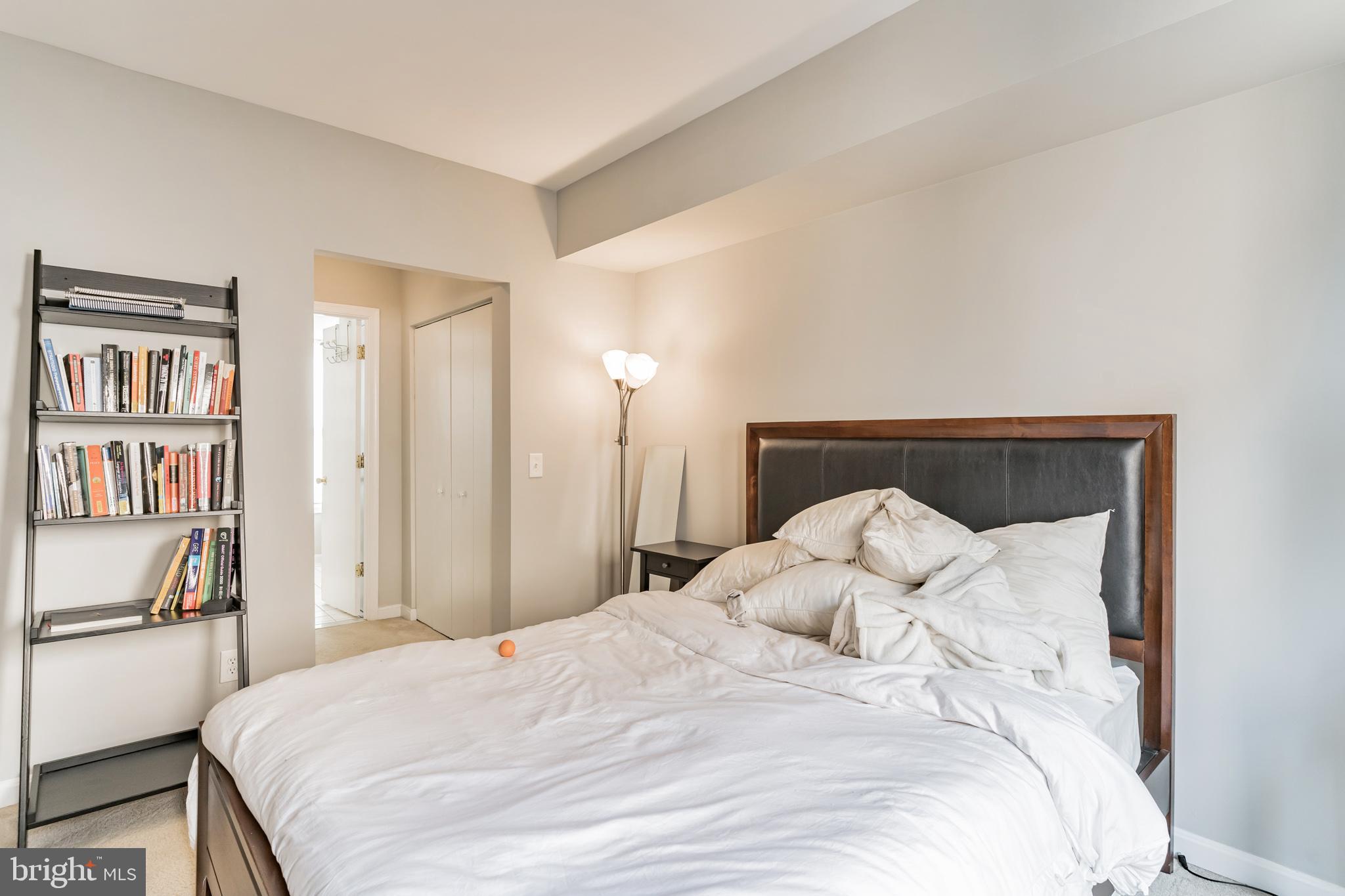 1208 1/2 33rd Street Northwest Washington, DC 20007 - Photo 28 of 30 a large bed with a bed and a book shelf