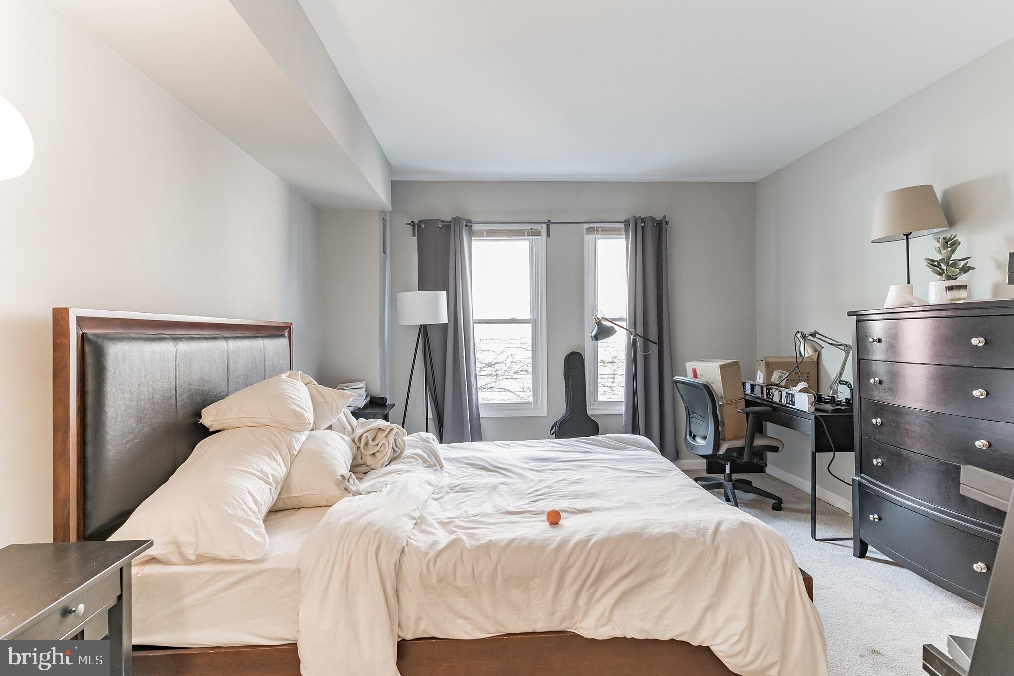 1208 1/2 33rd Street Northwest Washington, DC 20007 - Photo 30 of 30 a bedroom with a bed and wooden floor