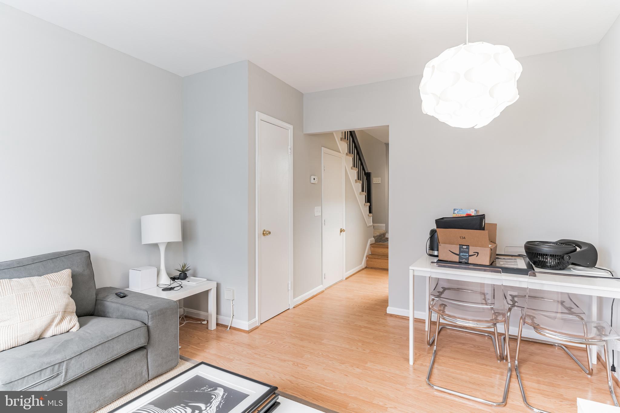 1208 1/2 33rd Street Northwest Washington, DC 20007 - Photo 8 of 30 a living room with furniture and a wooden floor