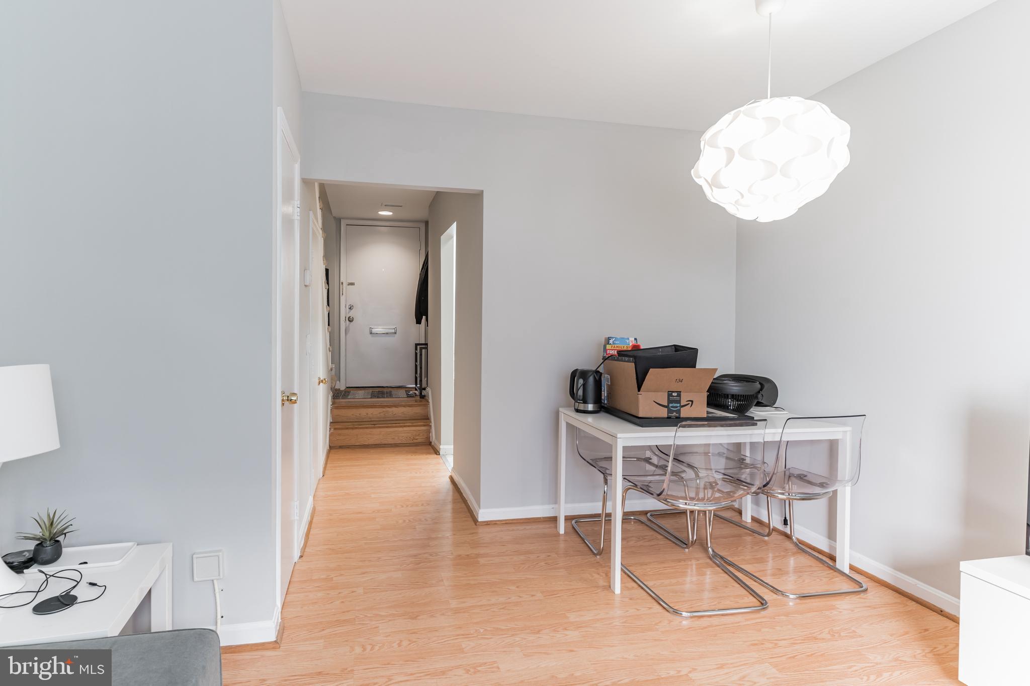 1208 1/2 33rd Street Northwest Washington, DC 20007 - Photo 10 of 30 a view of a dining room with furniture and wooden floor