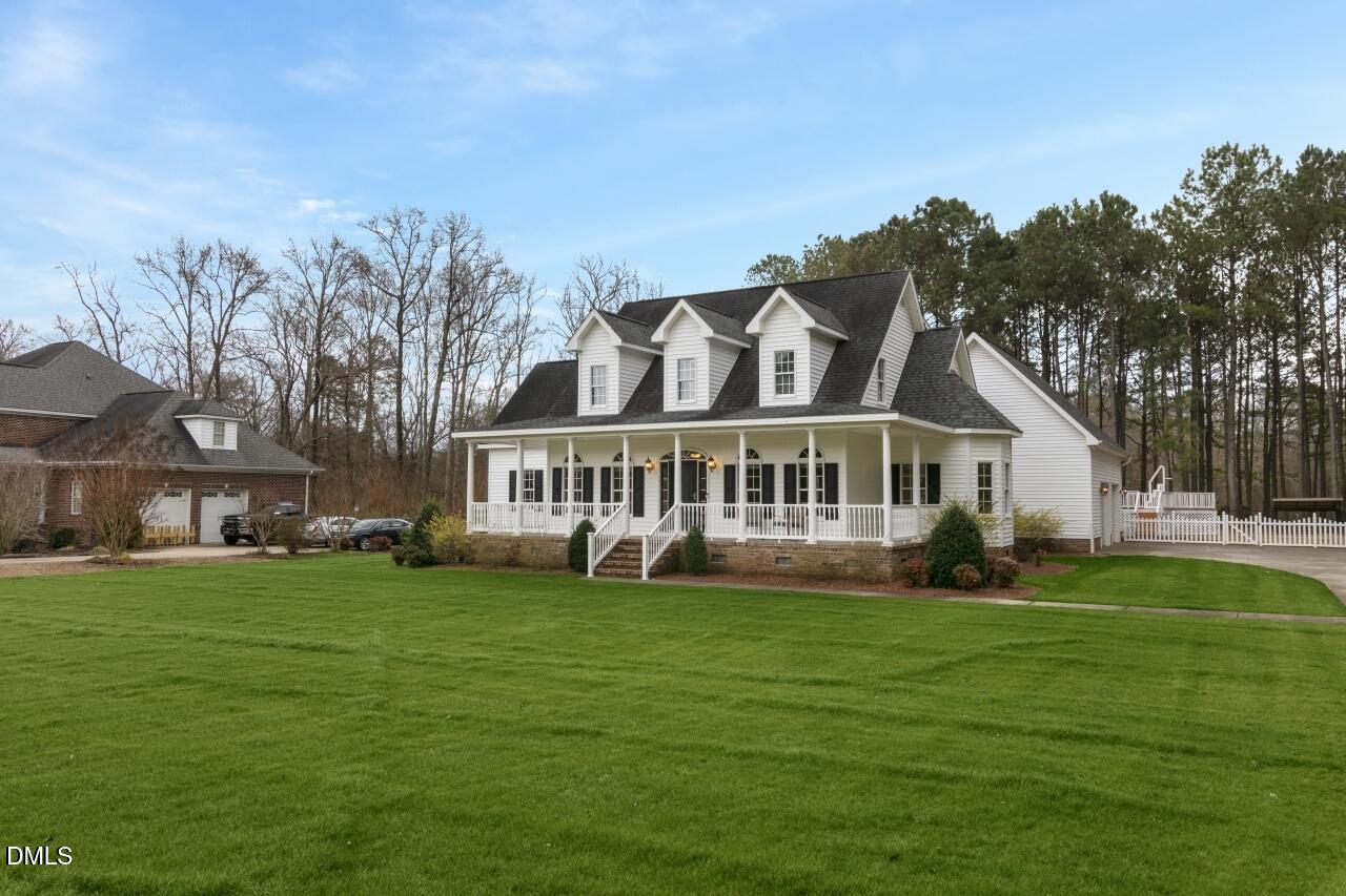 a view of a house with a big yard
