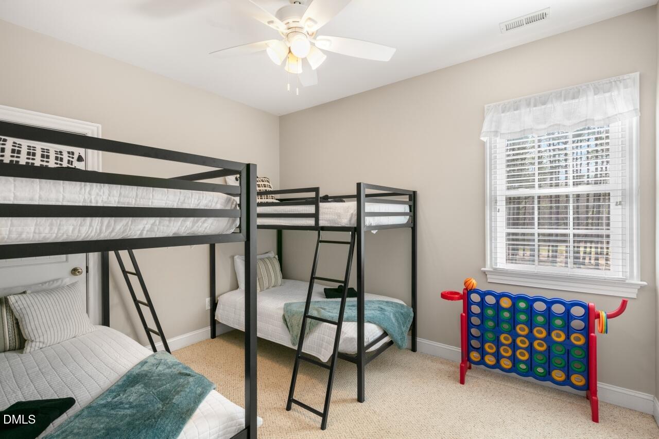 9199 Fox Run Road Bailey, NC 27807 - Photo 13 of 36 a bedroom with bunk bed and a window