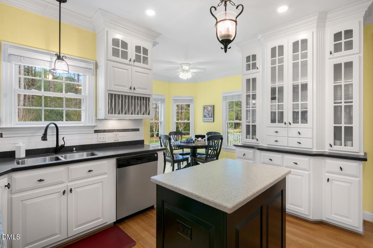 9199 Fox Run Road Bailey, NC 27807 - Photo 25 of 36 a kitchen with white cabinets and sink