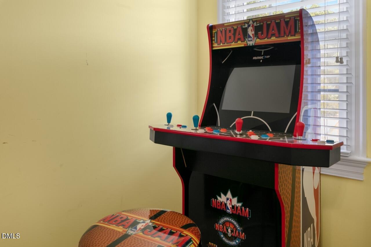 9199 Fox Run Road Bailey, NC 27807 - Photo 26 of 36 a living room with a fireplace and a table