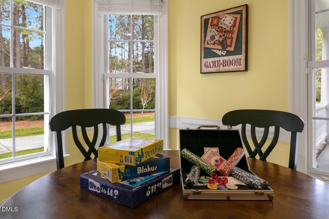 9199 Fox Run Road Bailey, NC 27807 - Photo 28 of 36 a living room with furniture and a floor to ceiling window