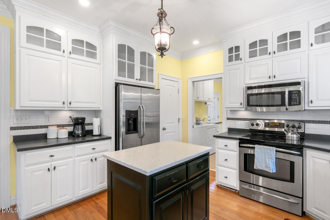 9199 Fox Run Road Bailey, NC 27807 - Photo 3 of 36 a kitchen with stainless steel appliances a stove microwave and refrigerator