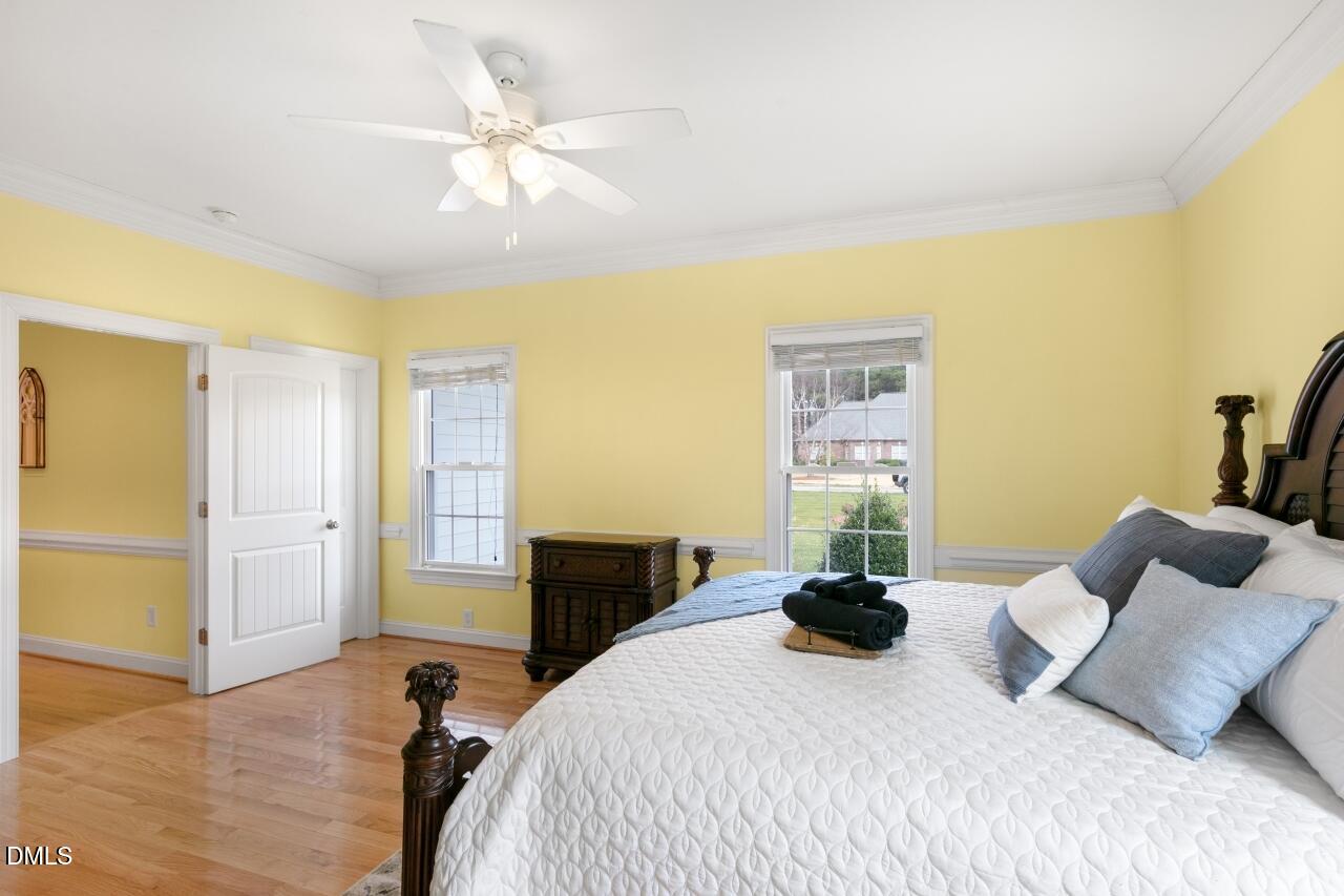 9199 Fox Run Road Bailey, NC 27807 - Photo 31 of 36 a bedroom with a bed and ceiling fan