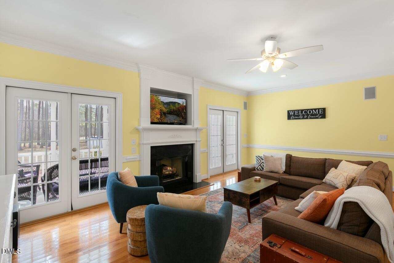 9199 Fox Run Road Bailey, NC 27807 - Photo 4 of 36 a living room with furniture fireplace and a flat screen tv
