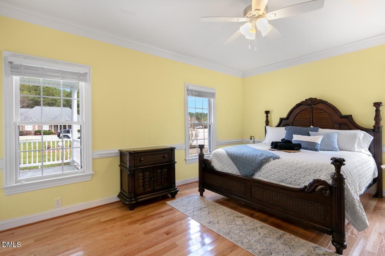 9199 Fox Run Road Bailey, NC 27807 - Photo 6 of 36 a bedroom with a bed and wooden floor