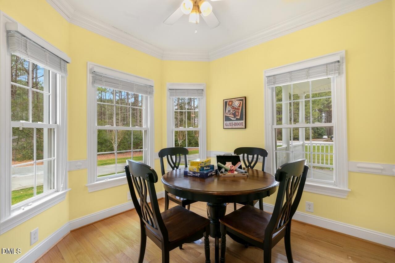9199 Fox Run Road Bailey, NC 27807 - Photo 7 of 36 a view of a dining room with furniture and wooden floor