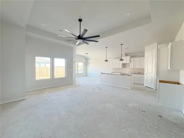a view of a kitchen with a sink and a window