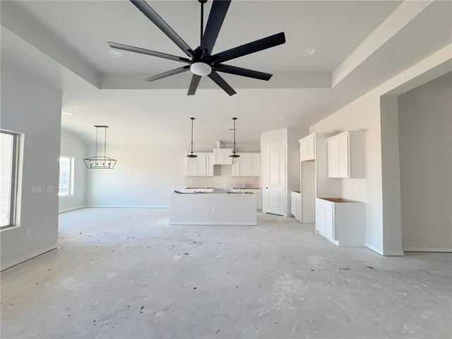 a view of a kitchen with a sink and a window