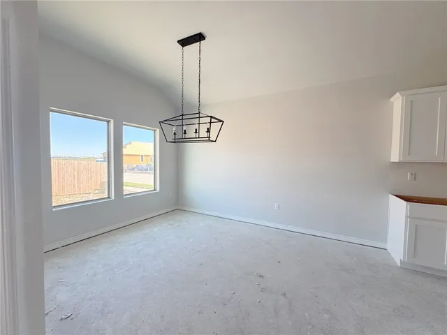 a view of empty room with windows