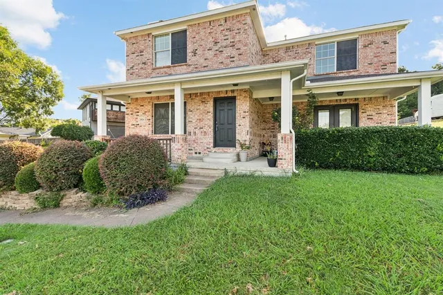 front view of a house with a yard