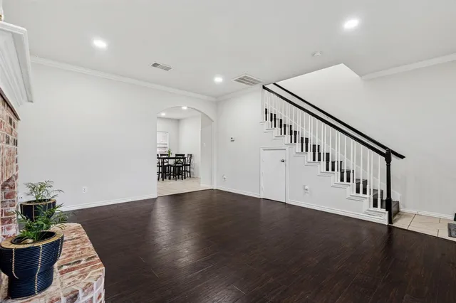a view of an entryway with wooden floor