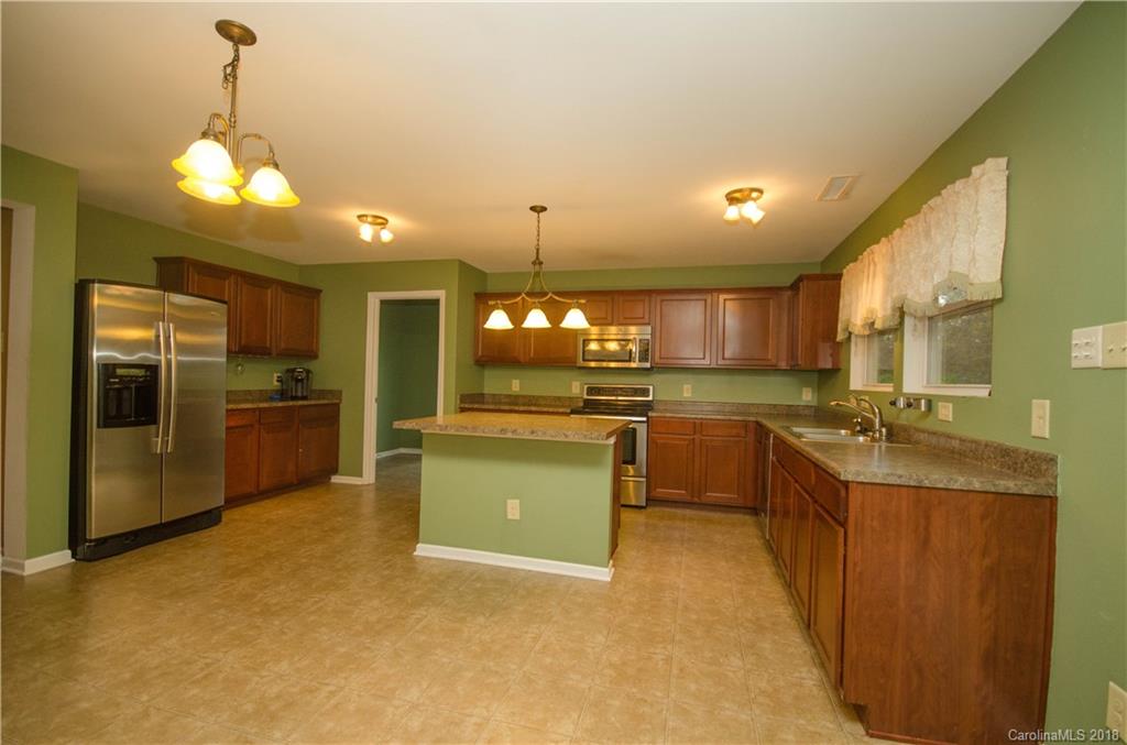 722 Chipmeadow Lane York, SC 29745 - Photo 2 of 13 a large kitchen with a large counter top a sink stainless steel appliances and cabinets