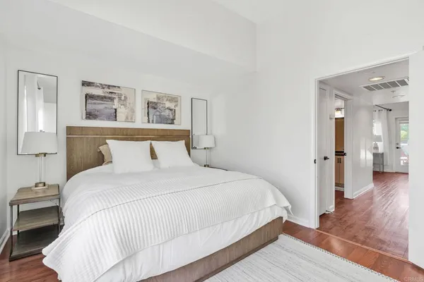 a bedroom with a bed and a view of bathroom