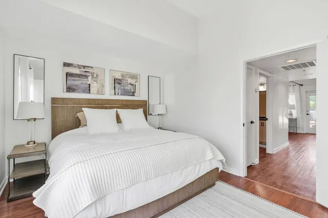 a bedroom with a bed and a view of bathroom