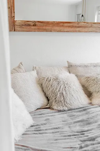 a view of a way to room with furniture and windows