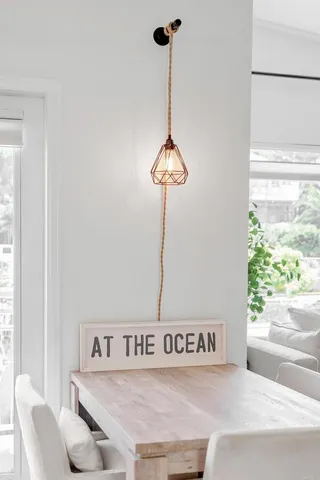 a living room with furniture and a painting