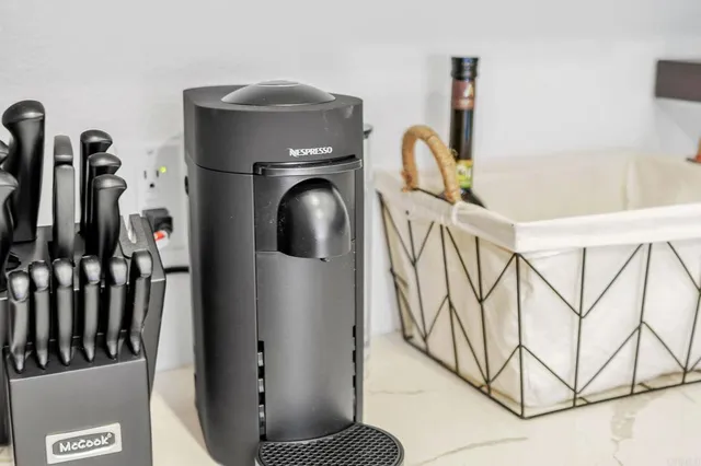 a white cabinet sitting next to a white wall
