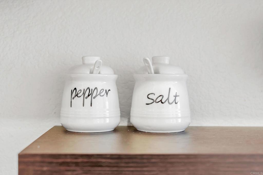 687 South Coast Highway 101, Unit 302 Encinitas, CA 92024 - Photo 25 of 32 a white cabinet sitting next to a white wall