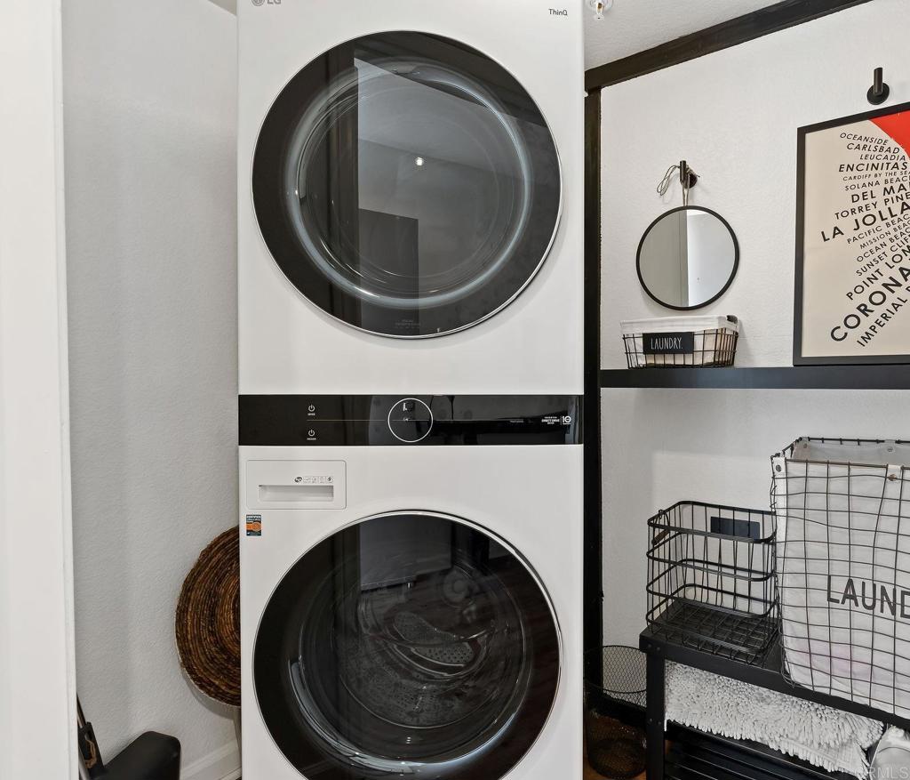 687 South Coast Highway 101, Unit 302 Encinitas, CA 92024 - Photo 26 of 32 a utility room with dryer and washer