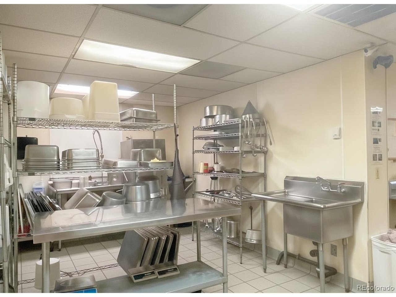 536 Cherokee Street Denver, CO 80204 - Photo 24 of 37 a kitchen with a sink and a table