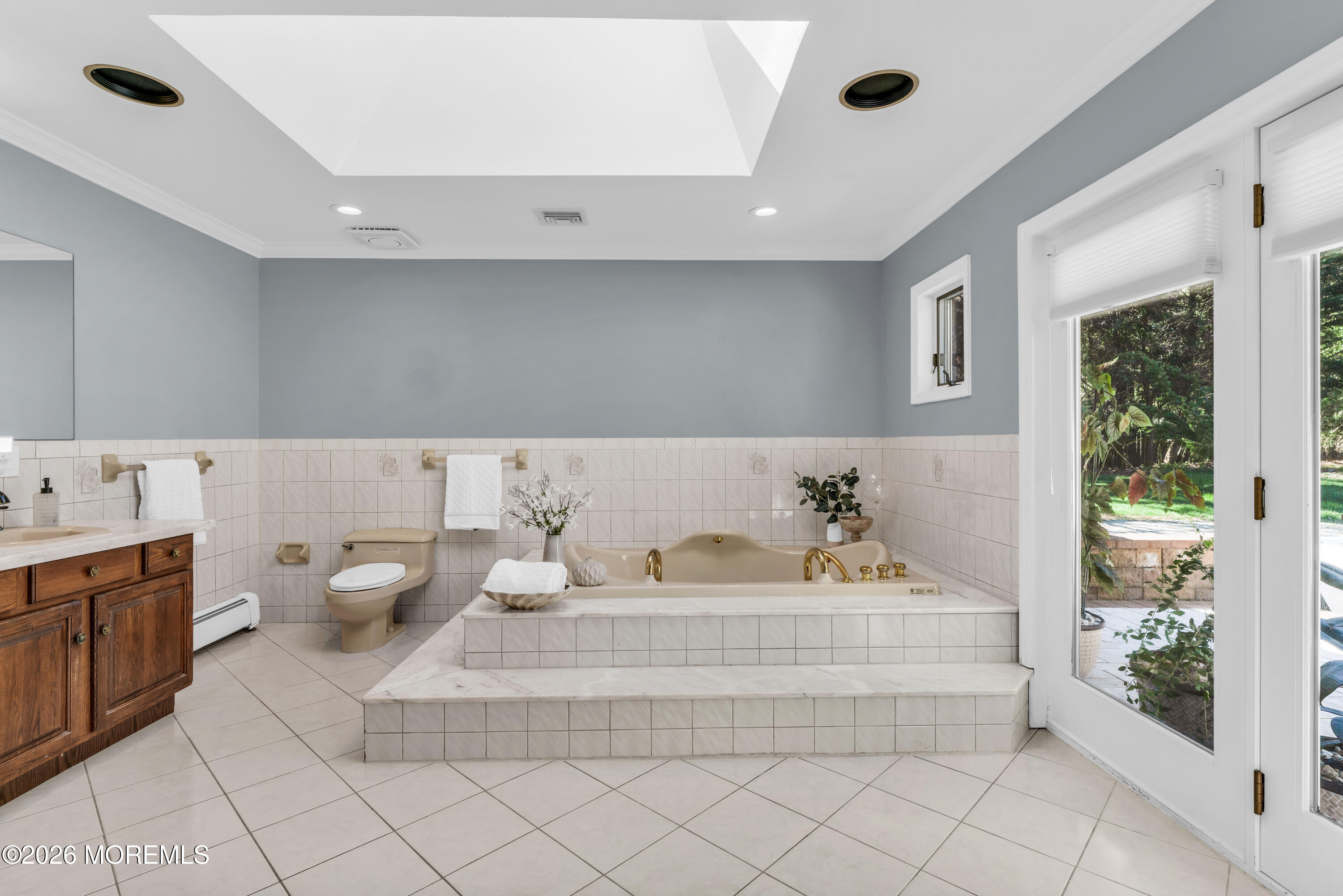 12 Red Fox Run Manalapan, NJ 07726 - Photo 24 of 57 a en suite bathroom with a granite countertop tub and a sink
