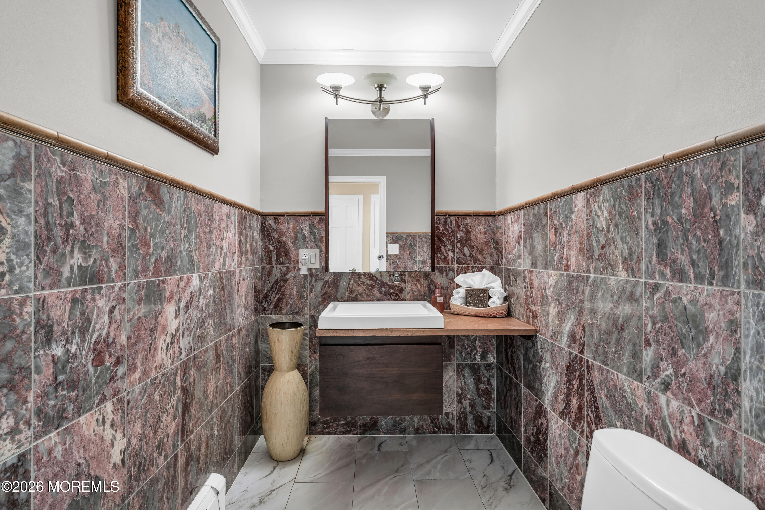 12 Red Fox Run Manalapan, NJ 07726 - Photo 27 of 57 a bathroom with a sink a toilet and mirror