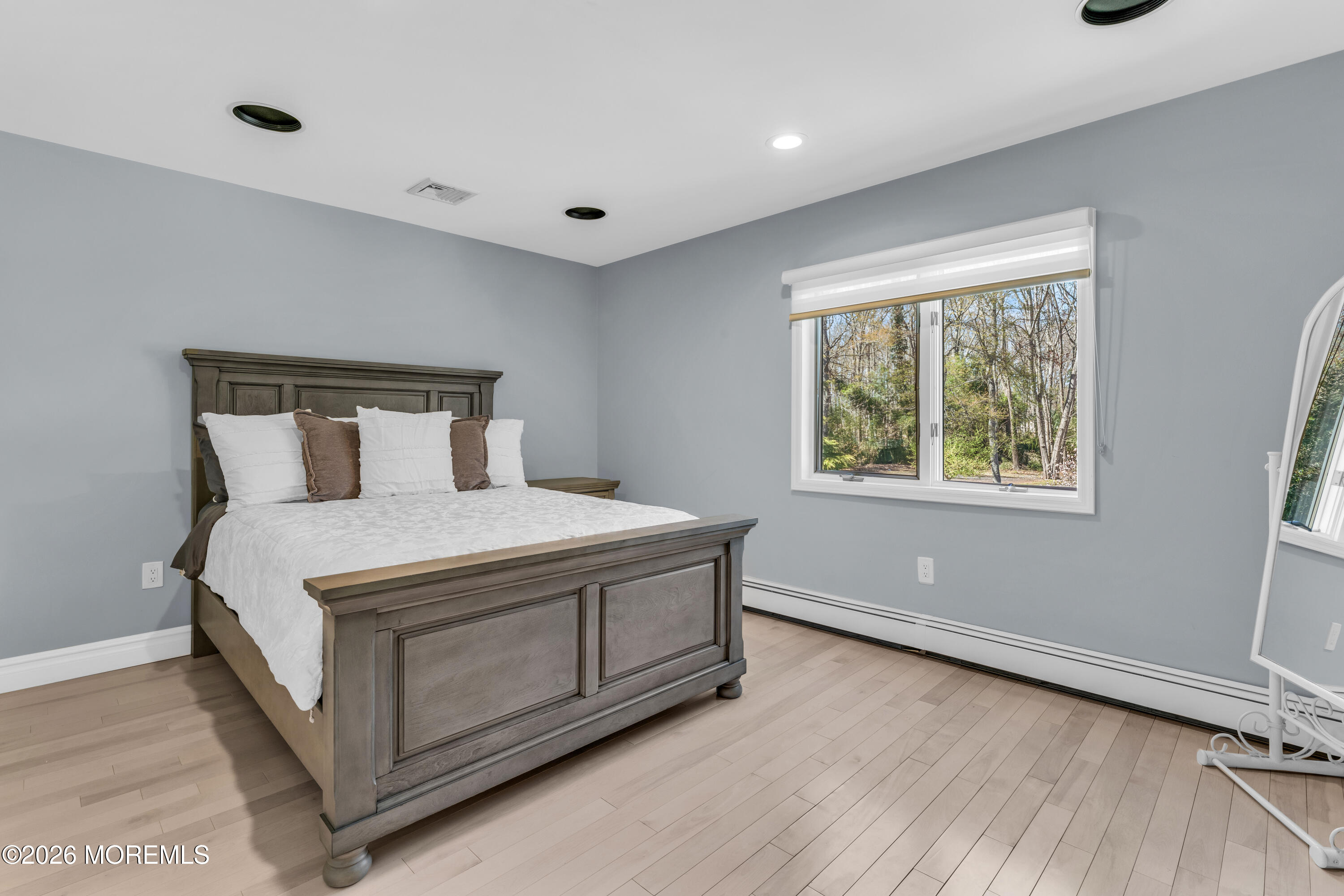 12 Red Fox Run Manalapan, NJ 07726 - Photo 33 of 57 a bedroom with a bed and windows
