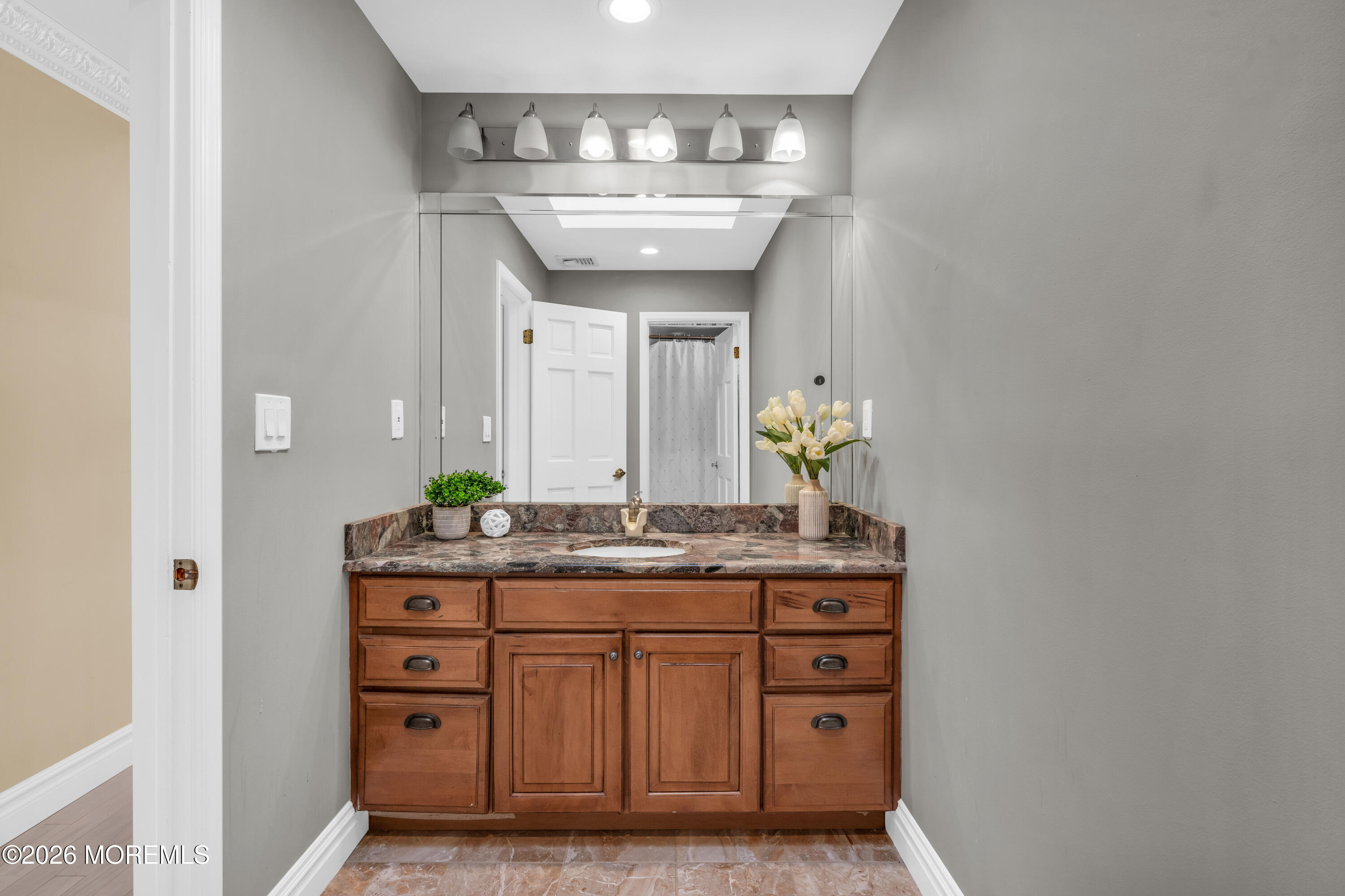 12 Red Fox Run Manalapan, NJ 07726 - Photo 34 of 57 a bathroom with a sink and a mirror
