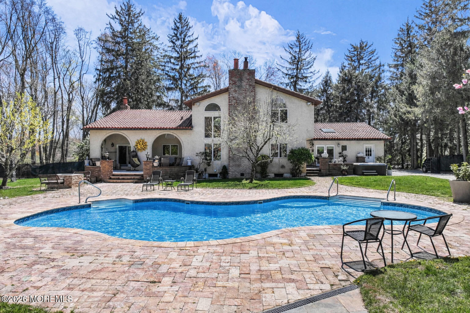 12 Red Fox Run Manalapan, NJ 07726 - Photo 46 of 57 a view of a house with swimming pool and sitting area