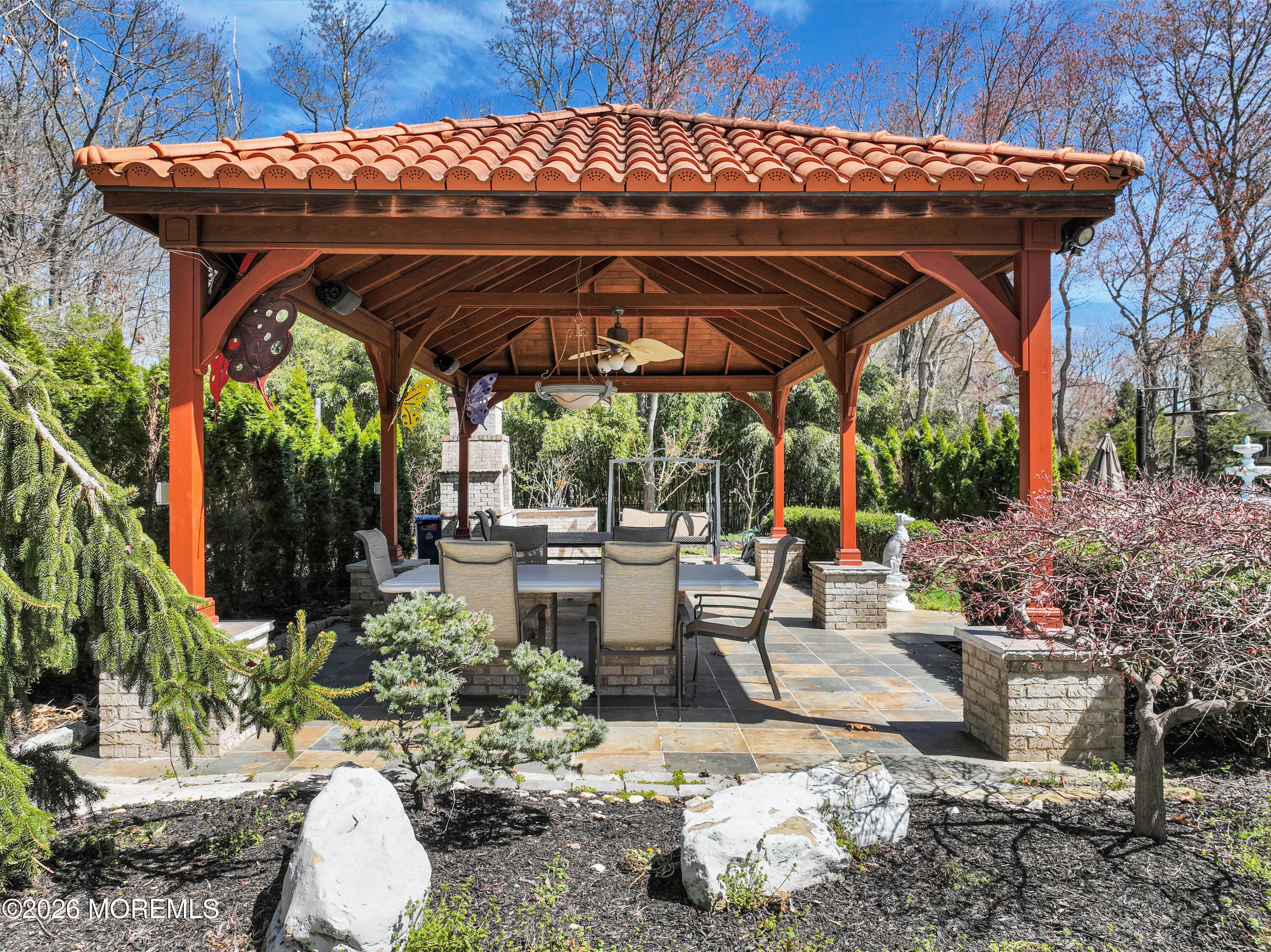 12 Red Fox Run Manalapan, NJ 07726 - Photo 48 of 57 a view of patio with a table and chairs under an umbrella