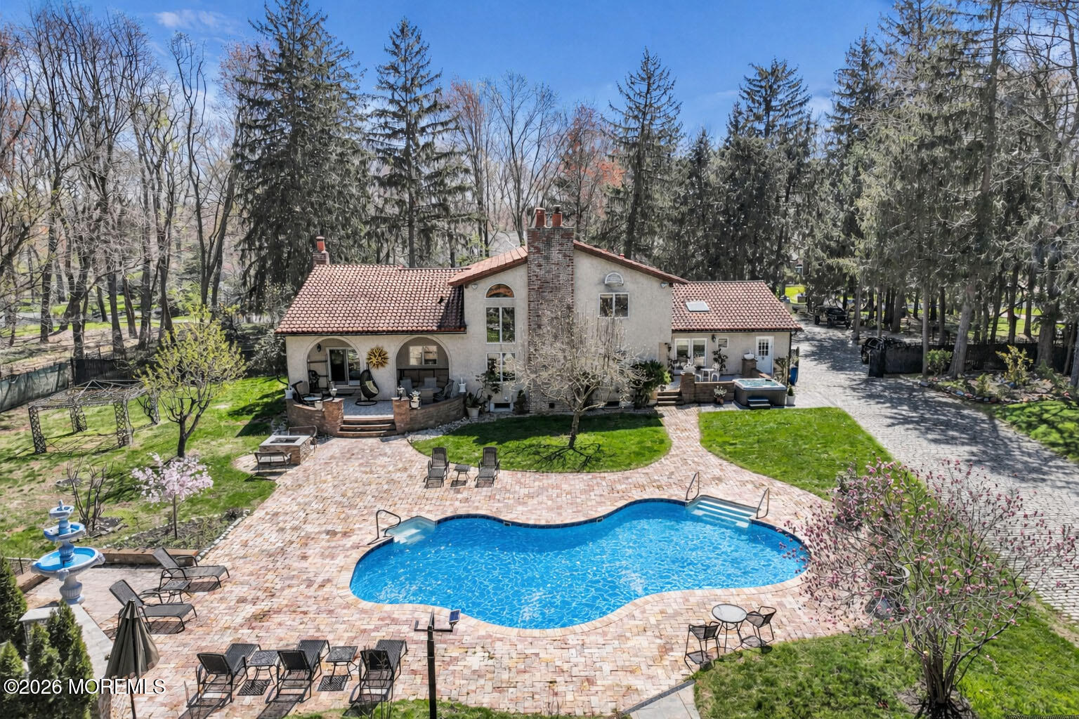 12 Red Fox Run Manalapan, NJ 07726 - Photo 52 of 57 a view of a patio with furniture and a garden