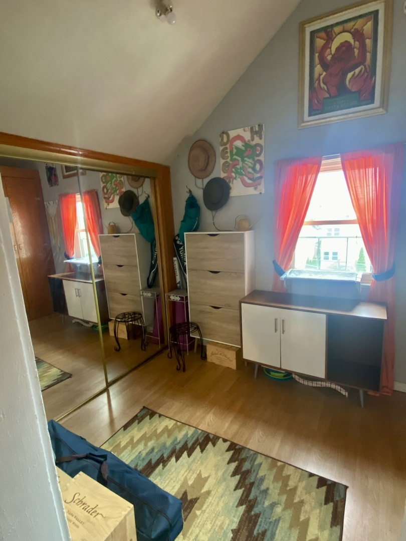 2027 West 22nd Place, Unit 3 Chicago, IL 60608 - Photo 10 of 16 a room with furniture and a window