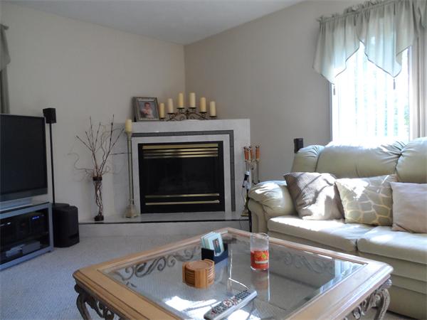 8 Rivers Edge Way Freetown, MA 02702 - Photo 8 of 17 a living room with furniture and a fireplace