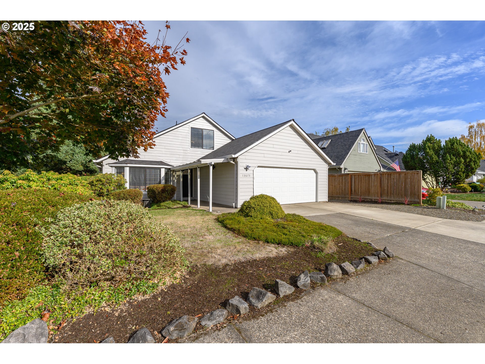 13675 Southwest Feiring Lane Tigard, OR 97223 - Photo 1 of 43 a front view of a house with a yard and garage