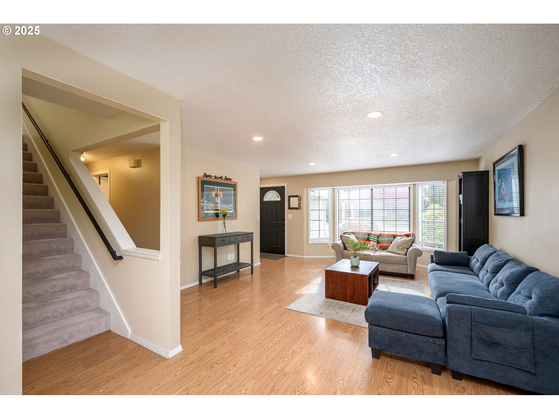 13675 Southwest Feiring Lane Tigard, OR 97223 - Photo 11 of 43 a living room with furniture and a wooden floor