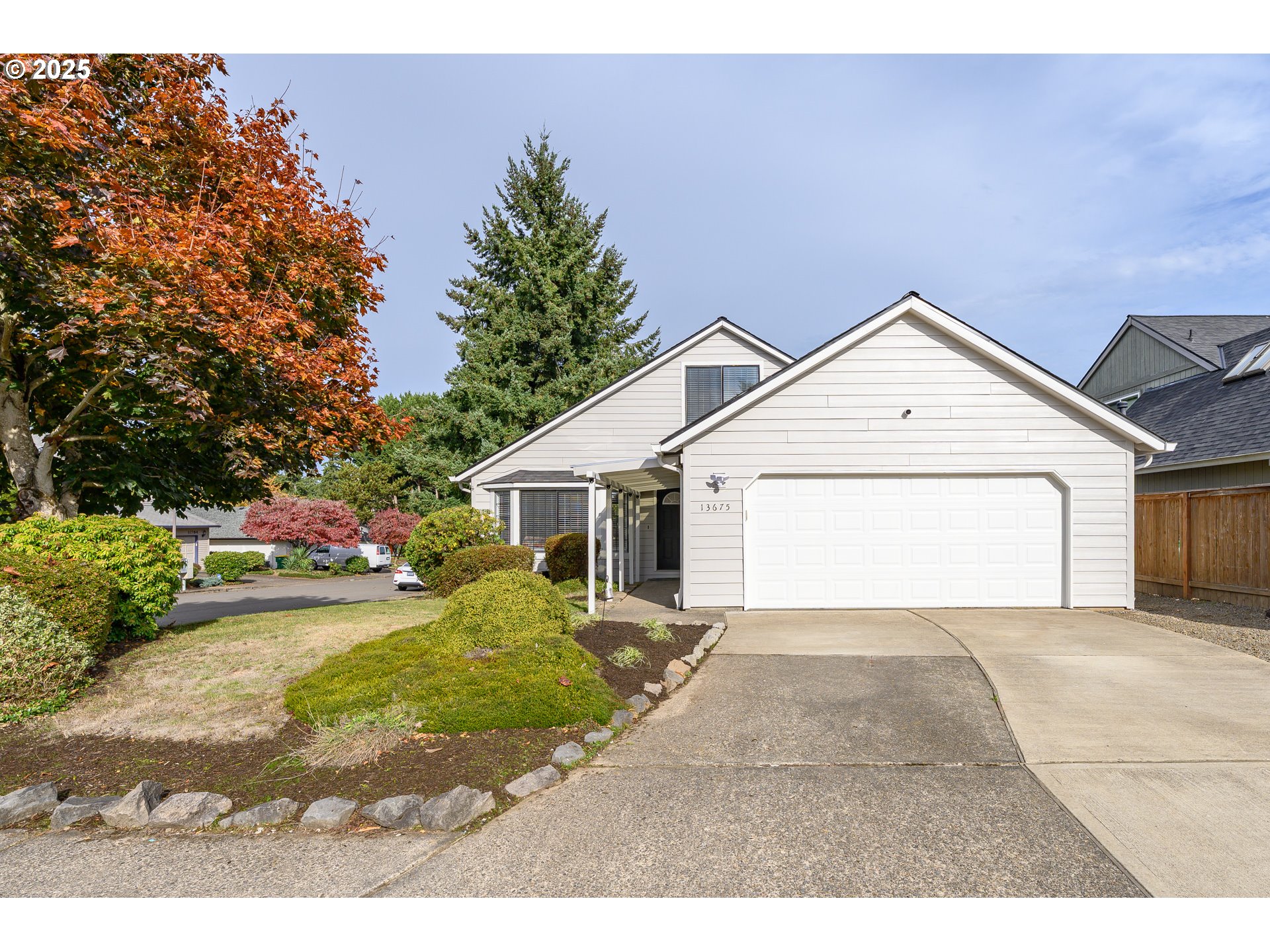 13675 Southwest Feiring Lane Tigard, OR 97223 - Photo 18 of 43 a view of a house with a yard and potted plants