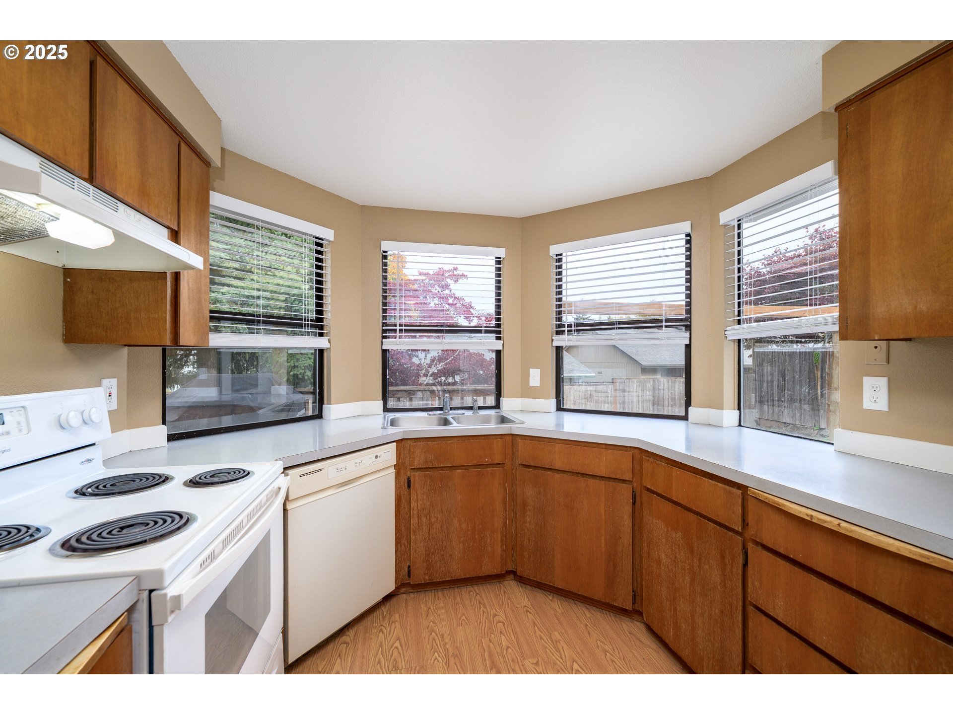 13675 Southwest Feiring Lane Tigard, OR 97223 - Photo 19 of 43 a kitchen with a sink stove and cabinets