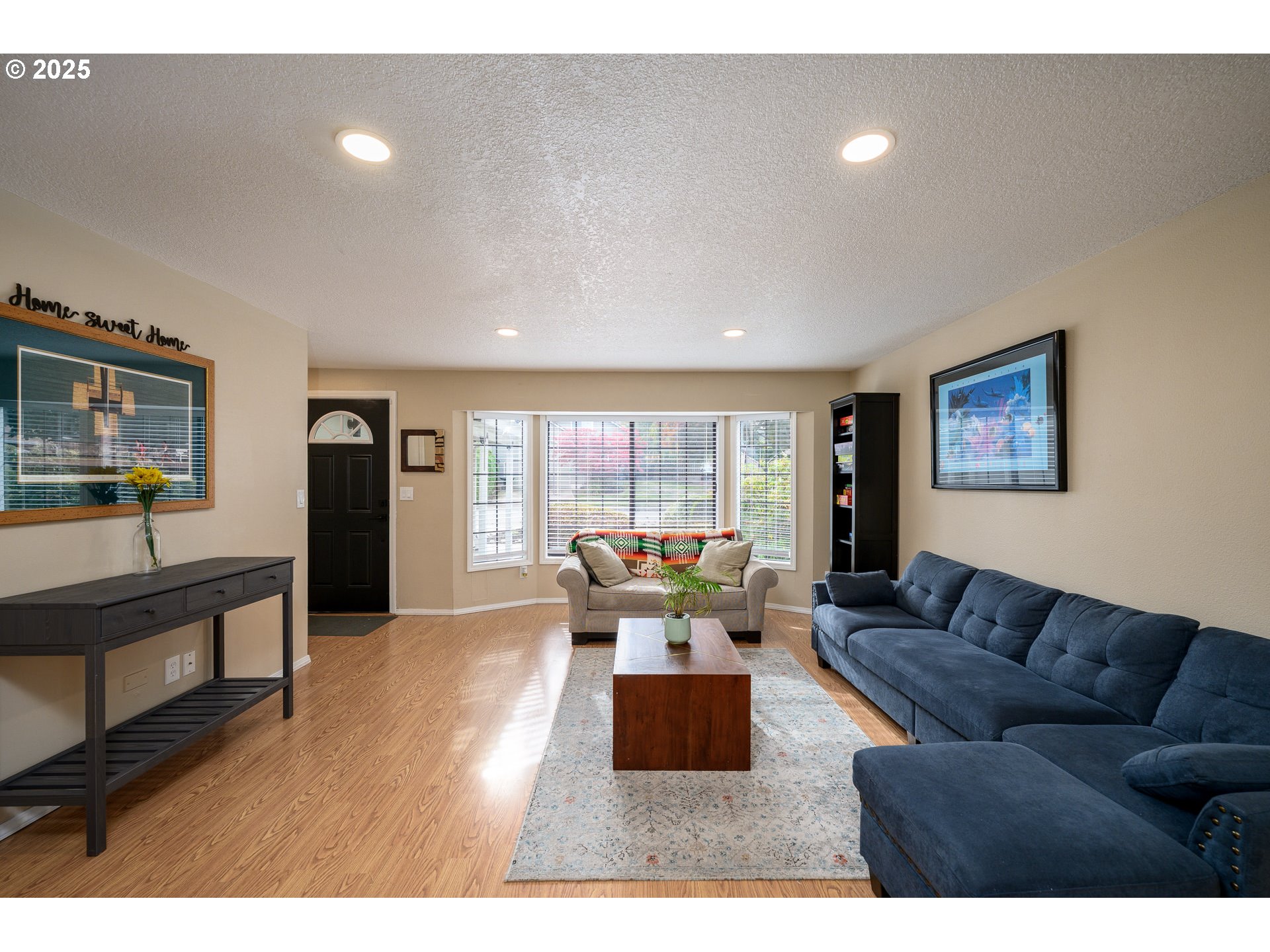 13675 Southwest Feiring Lane Tigard, OR 97223 - Photo 20 of 43 a living room with furniture large window and wooden floor