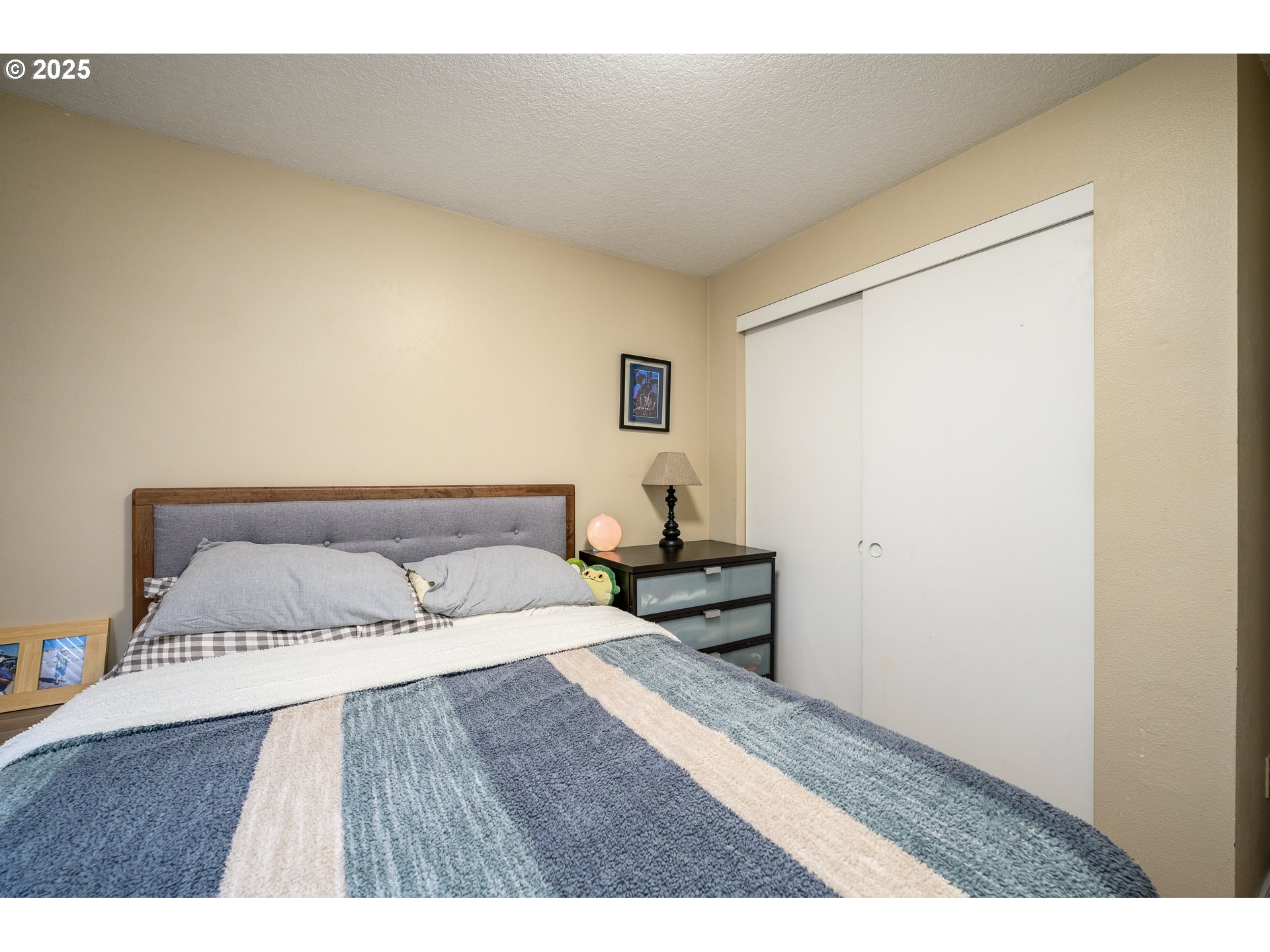 13675 Southwest Feiring Lane Tigard, OR 97223 - Photo 23 of 43 a bedroom with a bed and a night stand