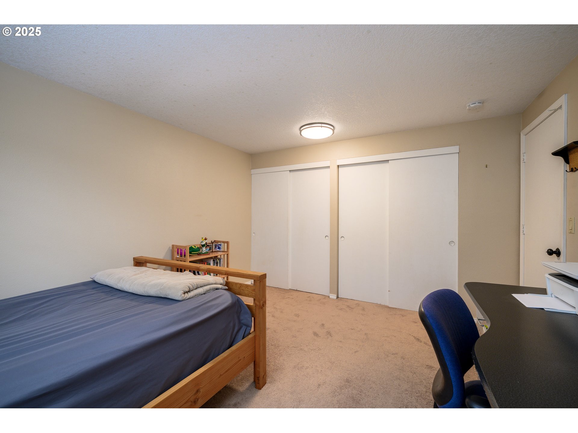 13675 Southwest Feiring Lane Tigard, OR 97223 - Photo 27 of 43 a bedroom with a bed and a table