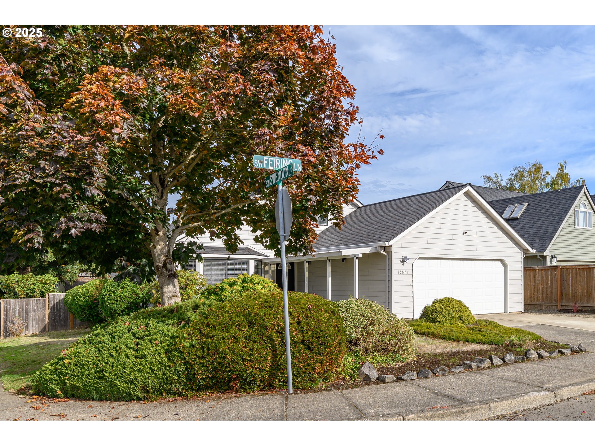 13675 Southwest Feiring Lane Tigard, OR 97223 - Photo 3 of 43 a front view of a house with a garden