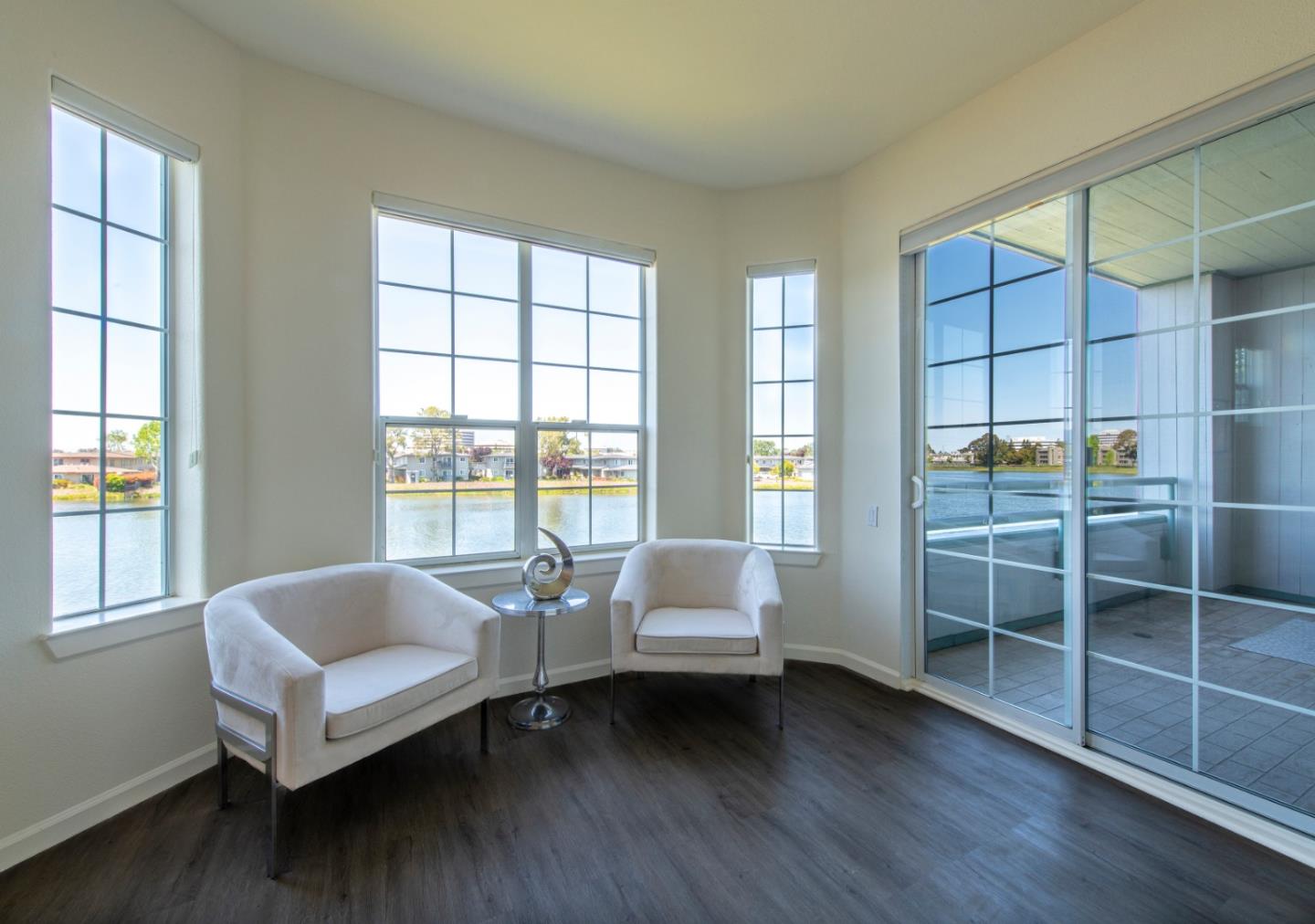 720 Promontory Point Lane, Unit 2104 Foster City, CA 94404 - Photo 11 of 27 a living room with furniture and a large window