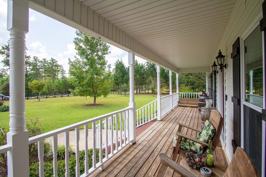 885 Jenkins Road, Unit 14 Forsyth, GA 31029 - Photo 2 of 33 a view of balcony with wooden floor and outdoor seating