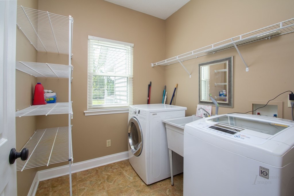 885 Jenkins Road, Unit 14 Forsyth, GA 31029 - Photo 16 of 33 a utility room with dryer and washer